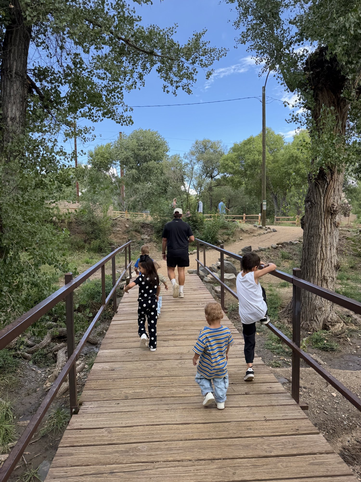 Kids crossing the footbridge over Granite Creek near downtown Prescott, AZ