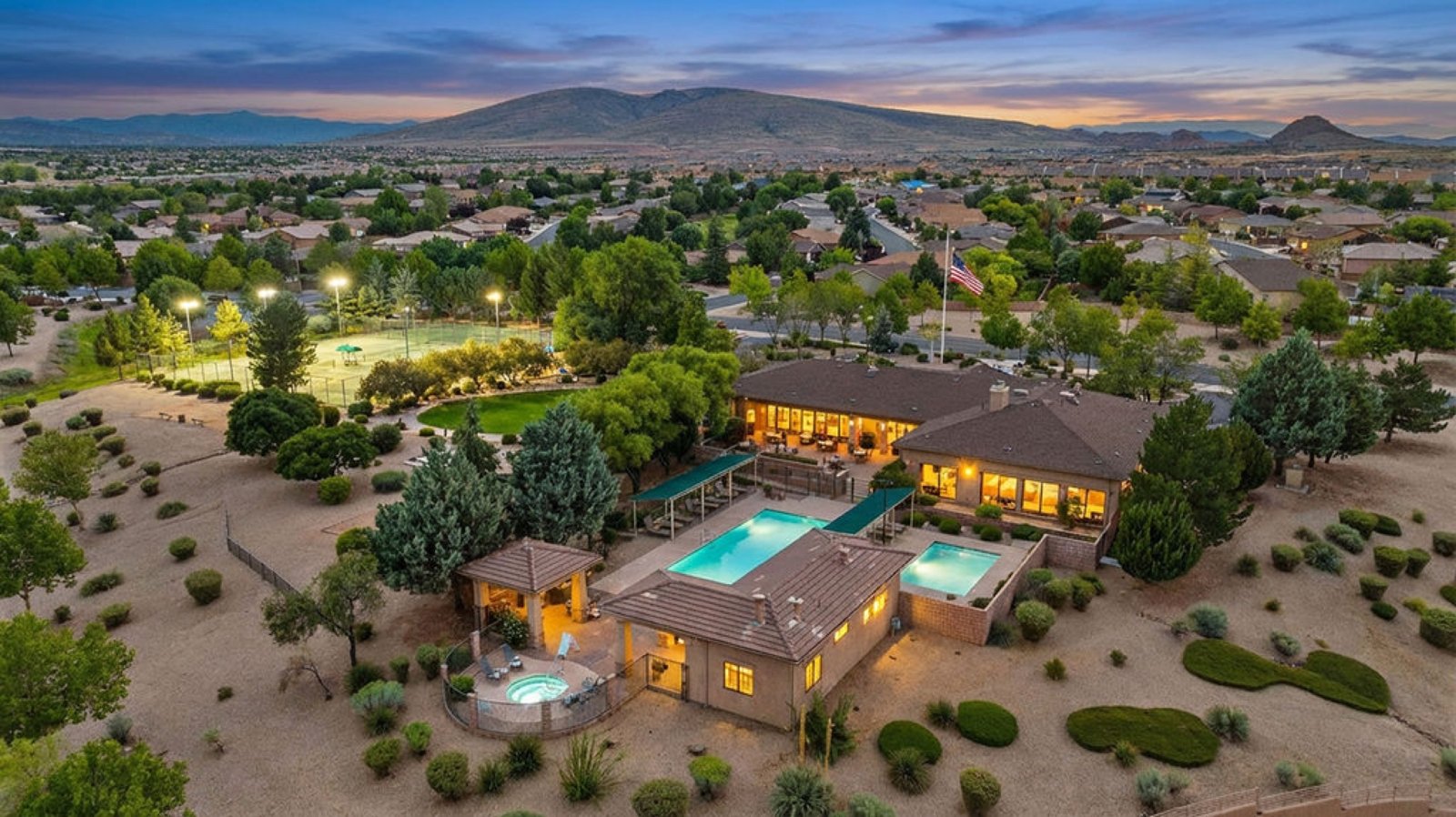 Aerial view of the Granville community center, pools and tennis courts at dusk, Prescott Valley AZ